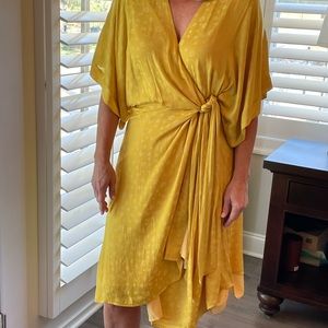Yellow dress with side tie. Very flattering and soft.